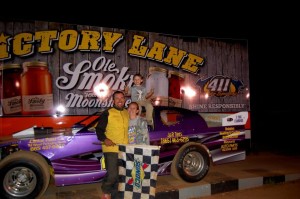 Robbie Comer and family in victory lane at 411 in 2013.