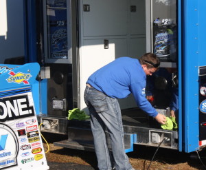 The Rocket team put Brandon Sheppard to work cleaning the hauler.