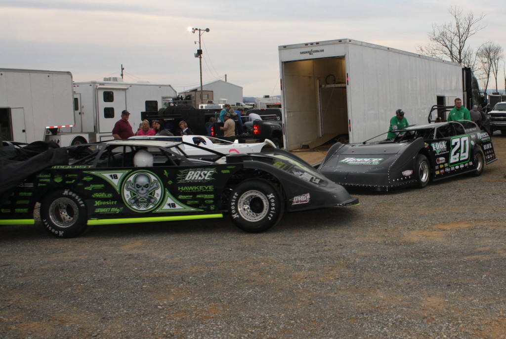 The Bloomquist Race Car of Scott Bloomquist is pushed past the Club 29 Race Car of Jimmy Owens