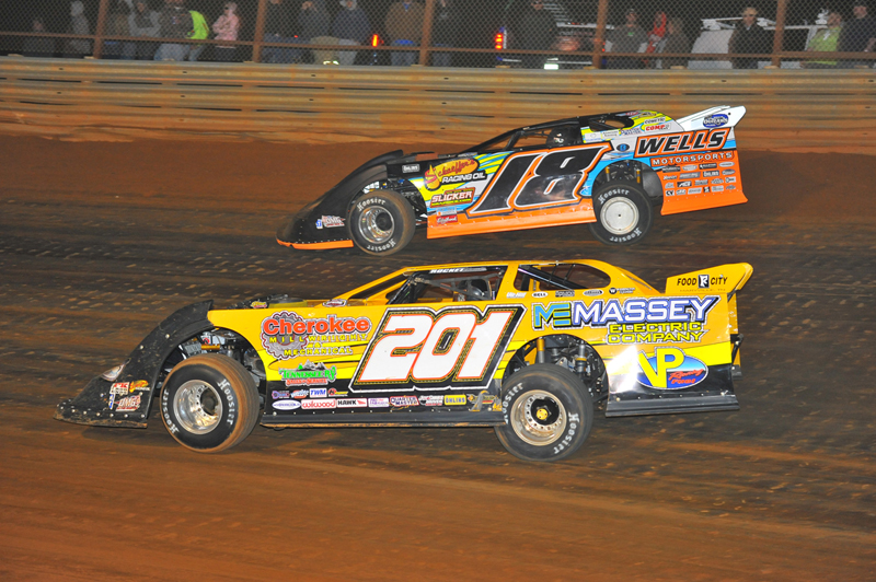 Billy Ogle Jr. gives a late challenge to Eric Wells.