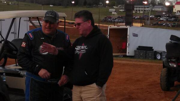 Vineyard talks with former NASCAR champion and noted safety guru Randy LaJoie after the accident.