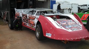 Pierce McCarter tends to the car that wiould be driven at Golden Isles by his brother Mack.