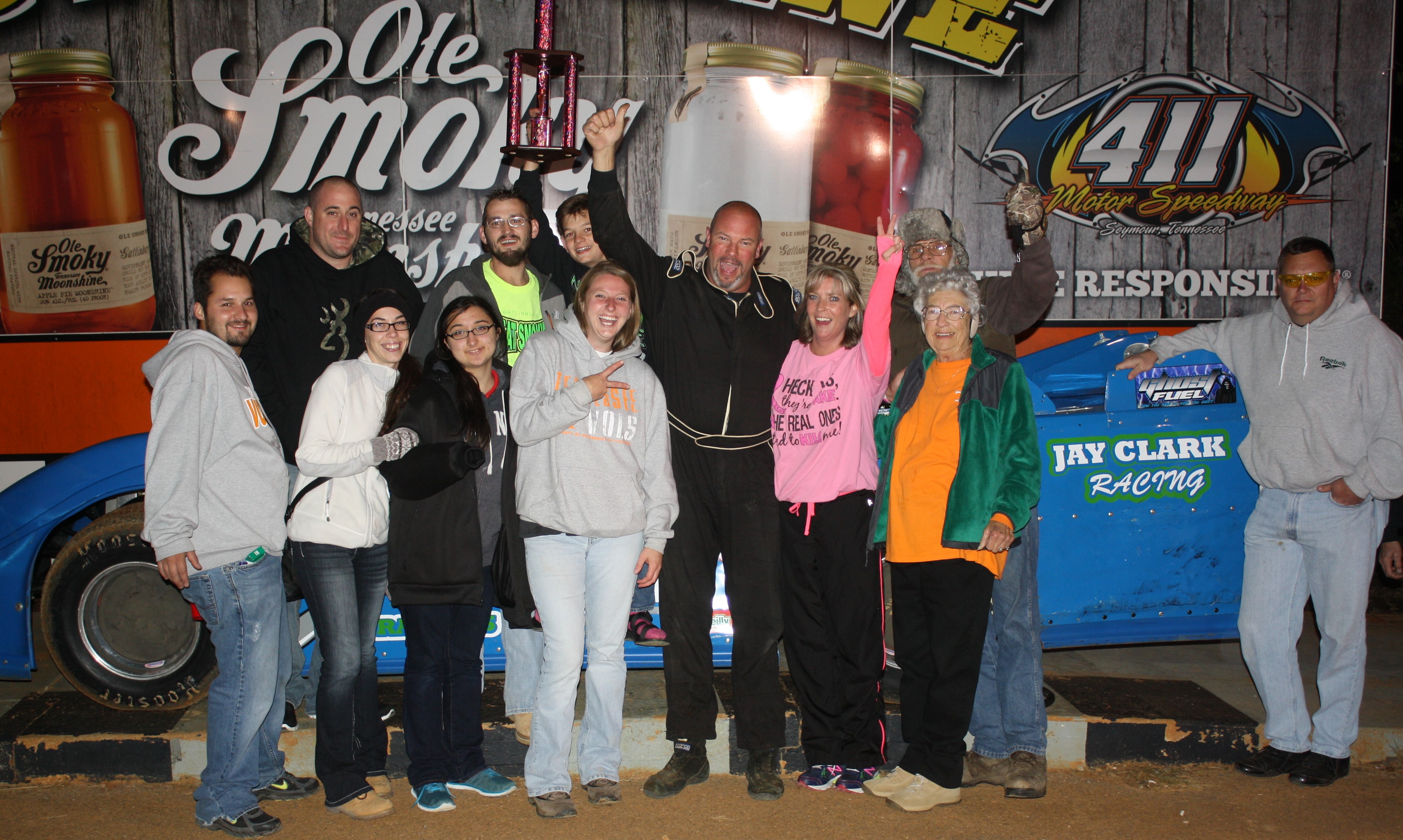 A happy crew celebrates Terry Poore's Sportsman win at 411. 