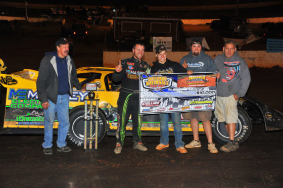 McIntosh and crew show off the driver's first $10,000 check